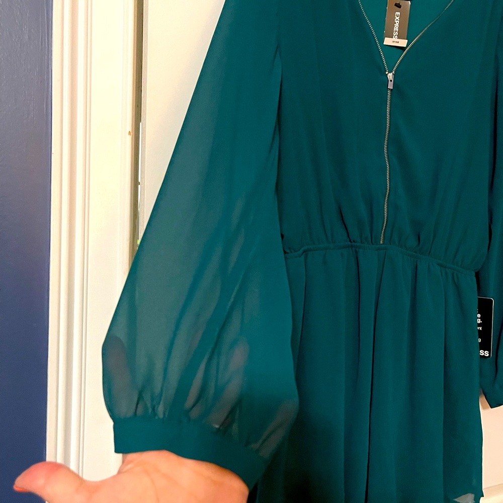 NWT express jade color romper. Lined with mesh style sleeves